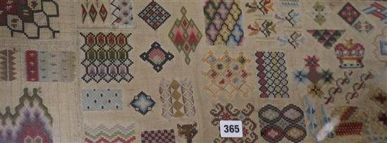 A late 19th century needlework sampler, depicting different patterns, 22 x 92cm